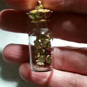 Vintage gold heart filled bottle necklace